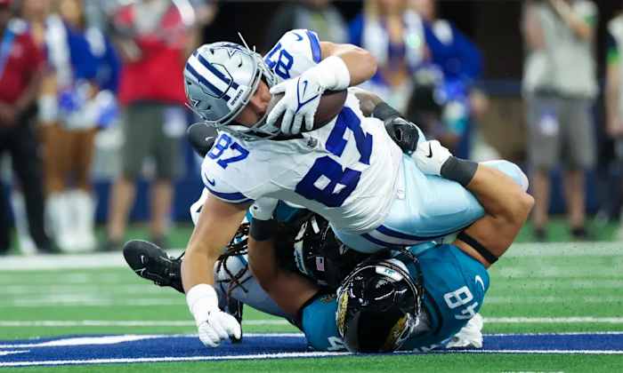 Ferguson getting tackled after a catch against the Jacksonville Jaguars.